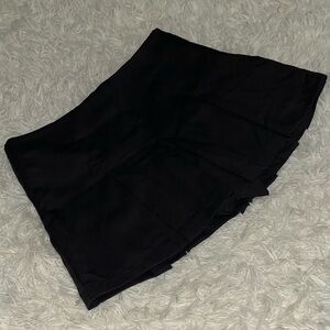 Pleated black mini skirt